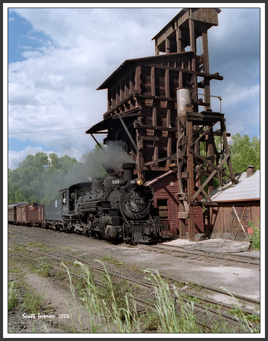 Photo: Cumbres & Toltec #488 passes coal tipple, Chama, NM yard