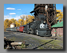 Photo: Cumbres & Toltec 487 passes the Chama coal tipple in autumn